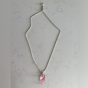 Kendra Scott long, gold pendant necklace with adjustable length